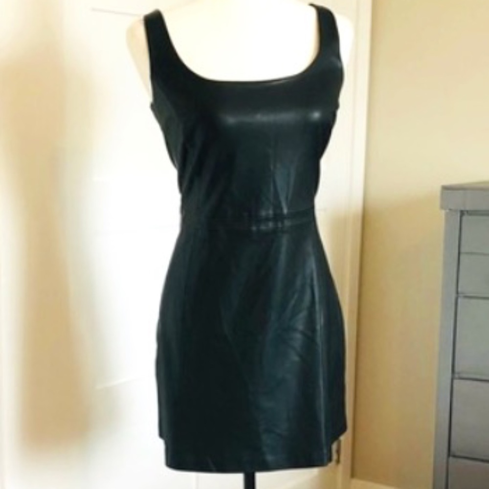 Black form fitting mini dress in faux leather